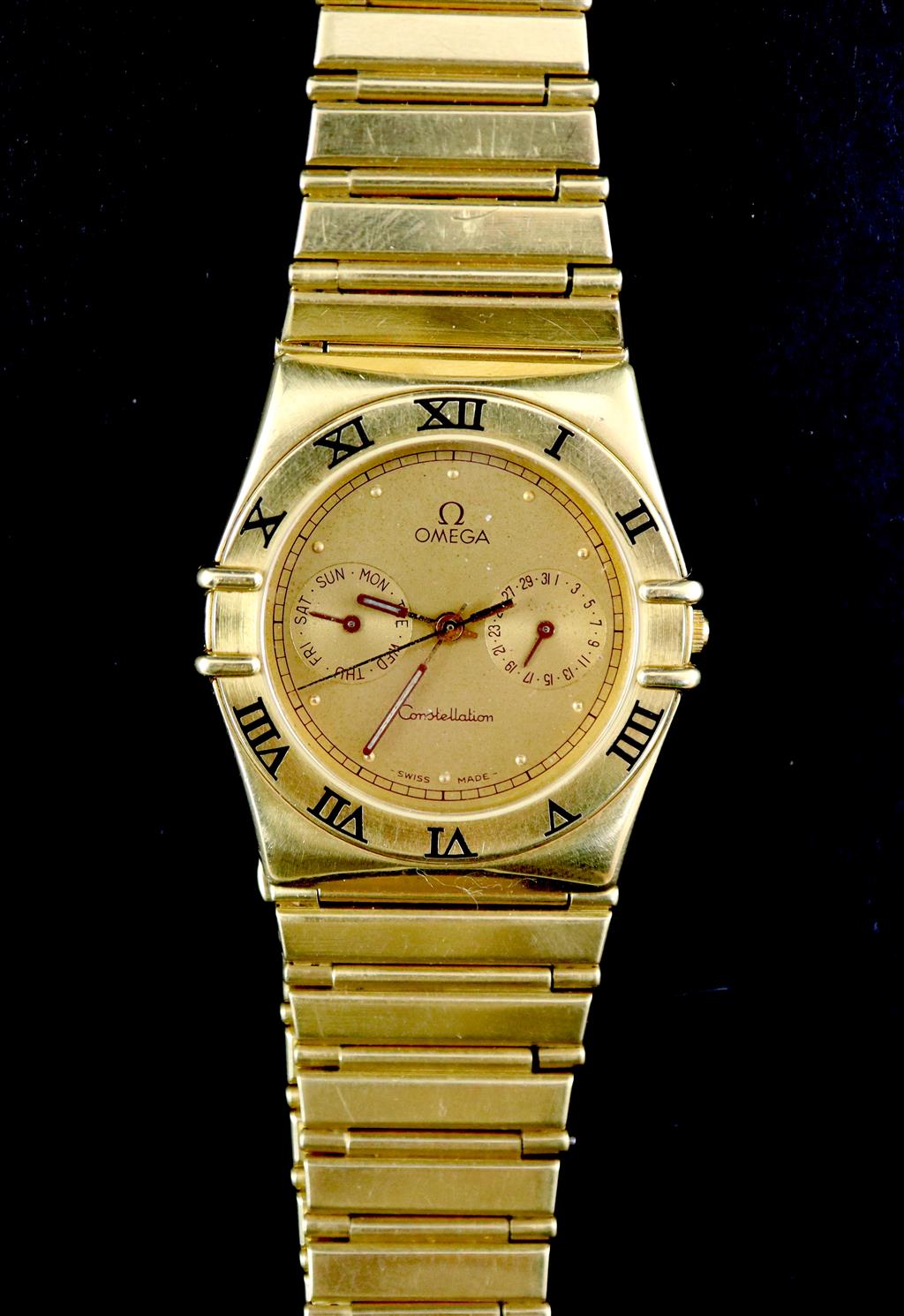 A gentlemans 1980s 18ct gold Omega Constellation quartz wrist watch,